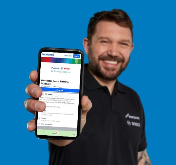 Installer showing phone screen with Facebook group on screen